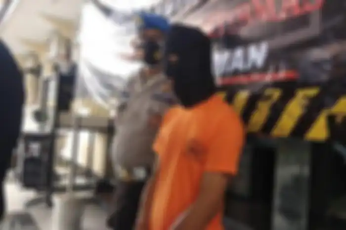 HNE, pemuda yang diduga melakukan pelanggaran UU ITE saat diamankan di Polres Sleman.