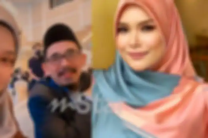 Penyanyi Nora Ariffin dan suaminya.
