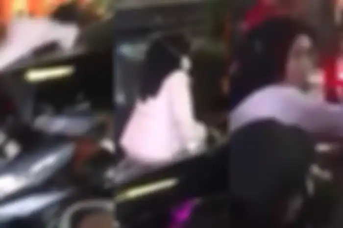 Wanita ngamuk hingga nekat naik ke atas kap mobil 