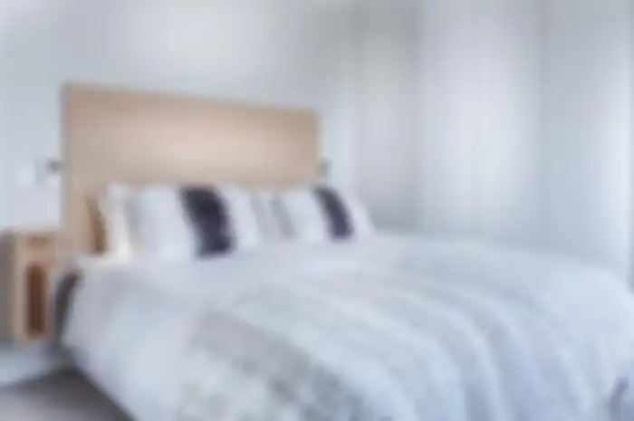 Ilustrasi tempat tidur dengan headboard kayu. (PIXABAY/JEAN VAN DER MEULEN) 