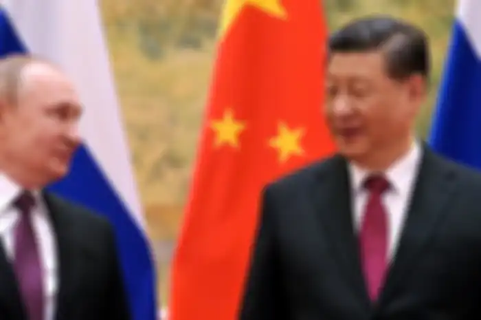 Presiden Rusia Vladimir Putin (kiri) dan mitranya dari China, Xi Jinping (kanan).