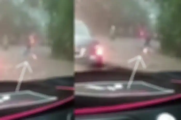 Video amatir merekam seorang pemotor di Bogor masuk ke dalam gorong-gorong lantaran terseret arus banjir.