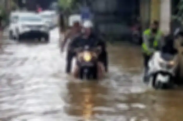 Ilustrasi kendaraan melintasi banjir