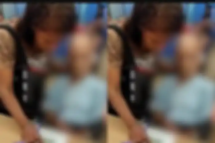 Erika de Souza Vieira Nunes (42) diduga membawa pria tua yang sudah meninggal ke bank.