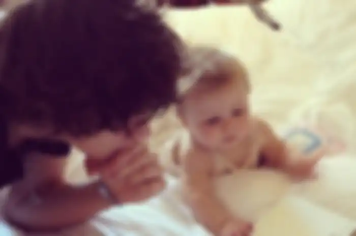 One Direction Member with Baby Lux