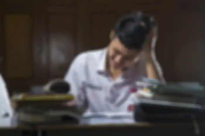foto ilustrasi, menampilkan pelajar sedang kesusahan mengerjakan tugas sekolah 