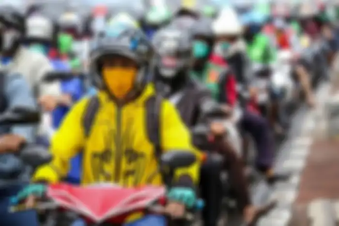 Ilustrasi pengendara motor. Ini lokasi jalan ganjil genap motor di Jakarta kalau tanpa perubahan.