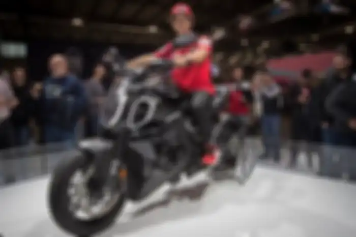 Enea Bastianini berpose bareng Ducati Diavel V4 di EICMA 2022.