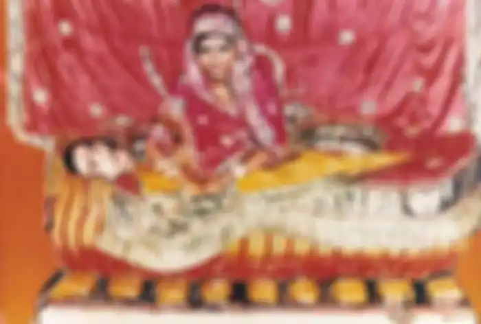 salah seorang wanita India yang melakukan pati obong sambil memangku suaminya