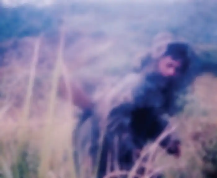 Tatang dengan ghillie suitnya