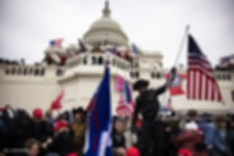 Pendukung Presiden Amerika Serikat (AS) Donald Trump menyerbu Gedung Capitol di Washington DC, 6 Januari 2021. Pendukung Trump berkumpul di ibu kota untuk menghentikan Kongres AS mengesahkan kemenangan Joe Biden.