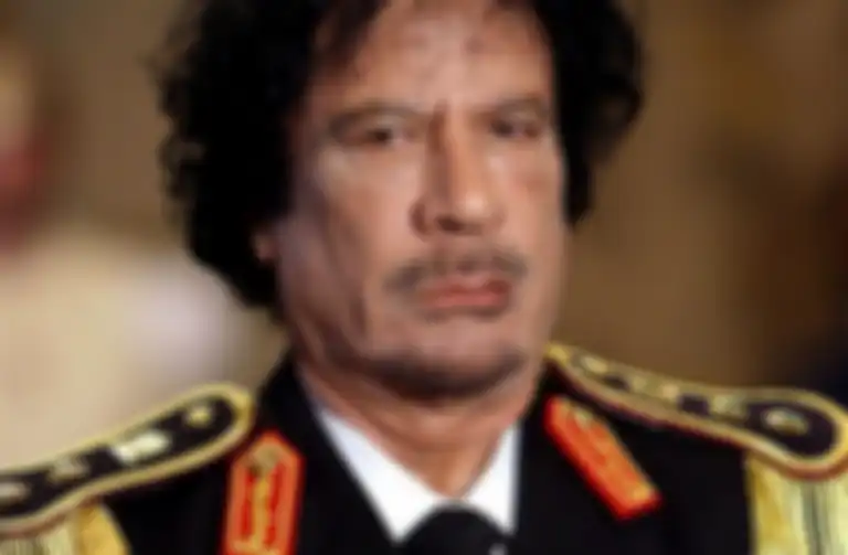Muammar Gaddafi.
