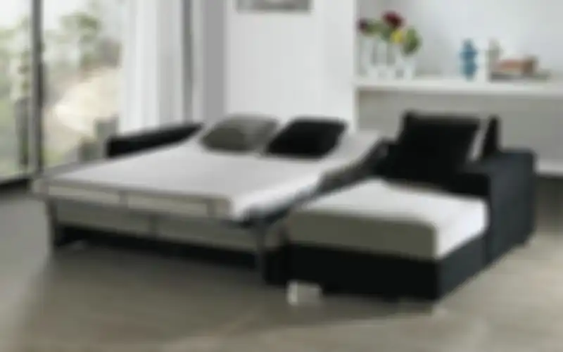 Sofa bed yang dapat dibuka tutup.