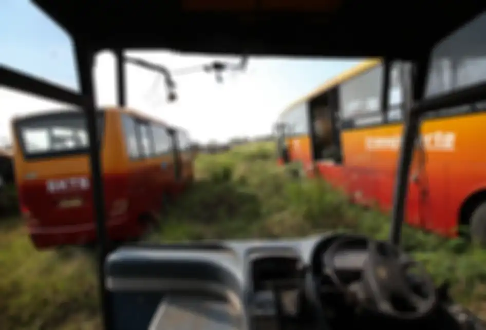 Ratusan bus Transjakarta terbengkalai di Kecamatan Dramaga, Kabupaten Bogor, Jumat (26/7/2019).