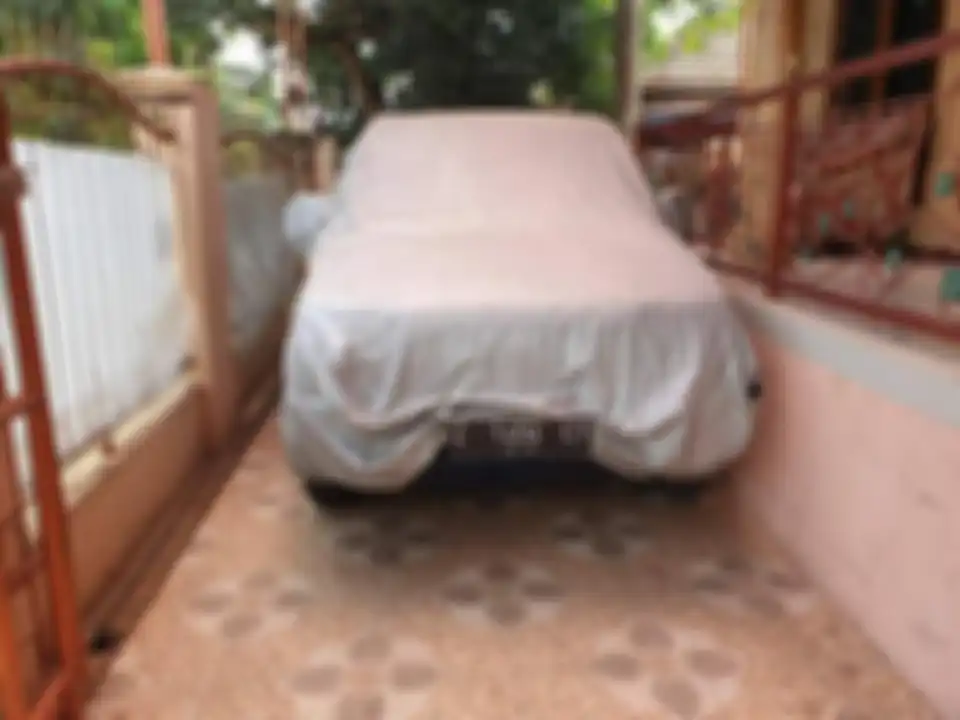 Kijang biru milik H. Adas