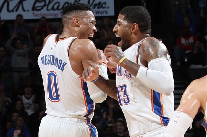 Selebrasi Russell Westbrook (kiri) dan Paul George (kanan) saat tampil untuk Oklahoma City Thunder dalam laga lanjutan NBA 2018/19, Selasa (12/2/2019) siang WIB.