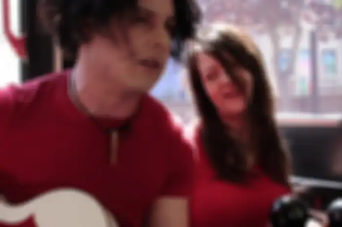 Jack and Meg White giving an impromptu concert to fans on a bus in Winnipeg, MB (02/07/2007).