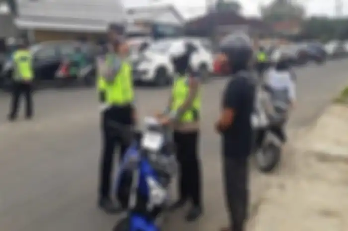 Ilustrasi, laporkan jika ada polisi masih lakukan tilang manual di jalan, Korlantas Polri siapkan sanksi tegas.