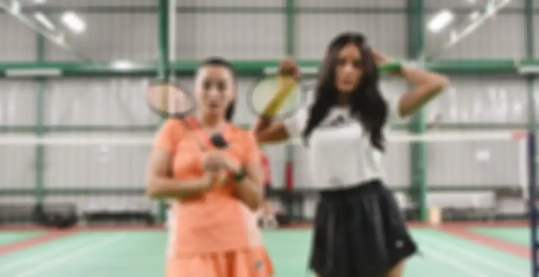 Erika Carlina dan Hesti Purwadinata main badminton