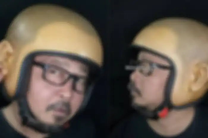Helm Skinhead buatan seniman Thailand ini, punya desain mirip kepala manusia lengkap dengan kuping di kedua sisi