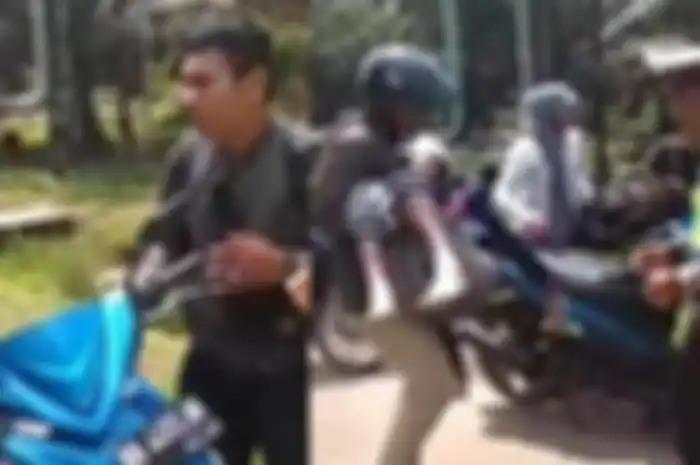 Polisi membantu pengendara motor yang ternyata sedag mengangkut jenazah