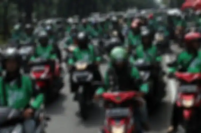 Demo ojek online di depan gedung DPR-MPR, Senin (23/4/2018).