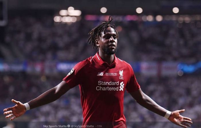 Penyerang Liverpool, Divock Origi, merayakan gol ke gawang Tottenham Hotspur dalam laga final Liga Champions di Stadion Wanda Metropolitano, Sabtu (1/6/2019).