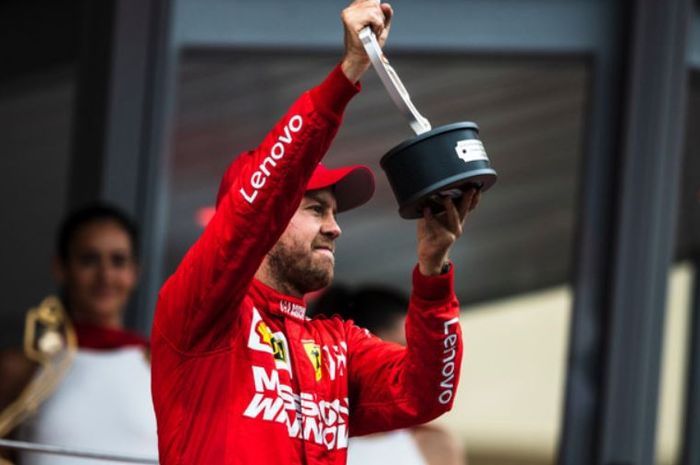 Pembalap Ferrari, Sebastian Vettel lakukan selebrasi usai finis di urutan dua pada F1 Monako 2019, Minggu (26/5/2019)