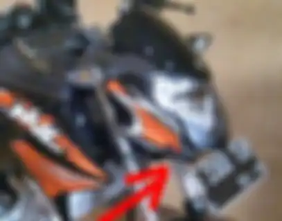 pemindahan pelat nomor dibawah headlamp