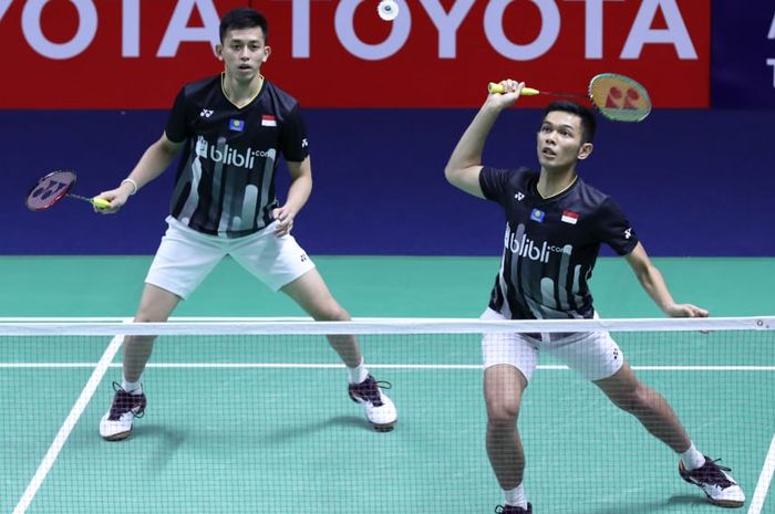 Pasangan ganda putra Indonesia, Muhammad Rian Ardianto (kiri) dan Fajar Alfian, pada babak pertama Thailand Open 2019 di Indoor Stadium Huamark, Bangkok, Selasa (30/7/2019).