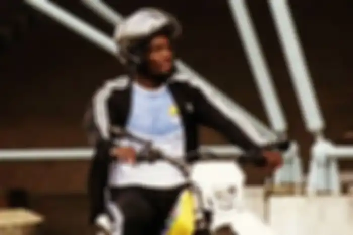 Michael Essien saat menunggangi motor trail di Bandung