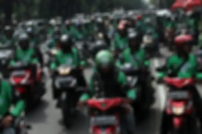 Demo ojek online di depan gedung DPR-MPR, Senin (23/4/2018).