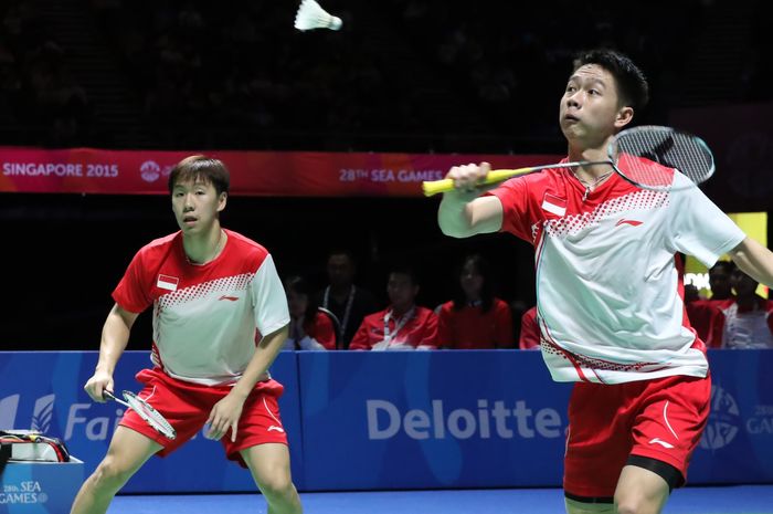 Pasangan ganda putra Indonesia, Marcus Fernaldi Gideon/Kevin Sanjaya Sukamuljo, saat tampil pada SEA Games Singapore 2015 di Singapore Indoor Stadium, Kallang, Singapura.