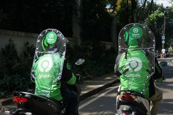 Ilustrasi mitra driver Gojek mengendarai sepeda motor.(Dok. Gojek)