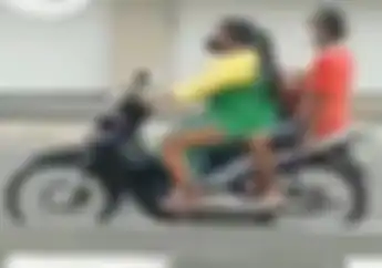 Pengendara Asik Boncengan Tidak Pakai Helm dan Lawan Arus, Berapa Denda Tilangnya