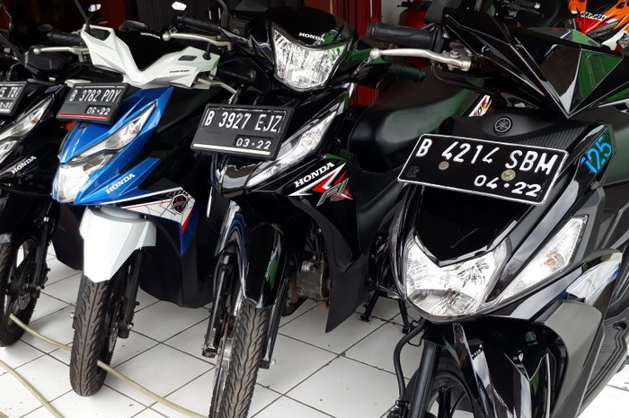 Ilustrasi pedagang motor bekas.