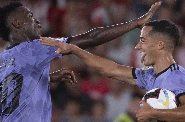 Vinicius Junior dan Lucas Vazquez merayakan gol dalam laga Liga Spanyol, Almeria vs Real Madrid, di Stadion de los Juegos Mediterraneos, Minggu (14/8/2022).