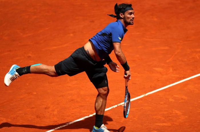 Petenis asal Italia, Fabio Fognini saat melakukan pukulan