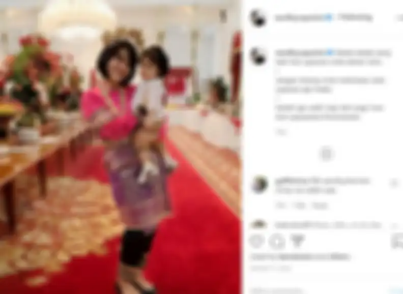Ajudan Iriana Jokwoi menggendong Sedah Mirah, putri Kahiyang Ayu