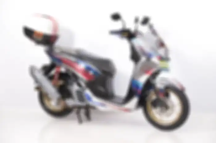 Konsepnya touring banget, modifikasi motor Yamaha Lexi sabet juara.